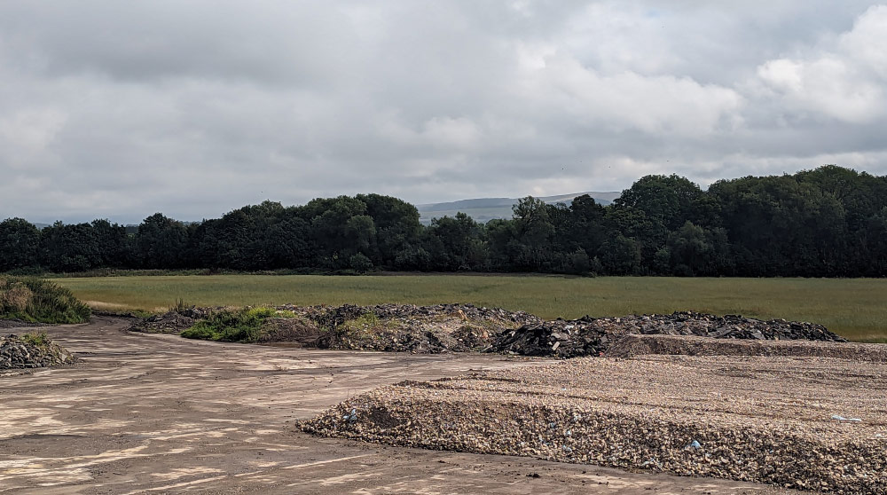 photo showing site wate land and field